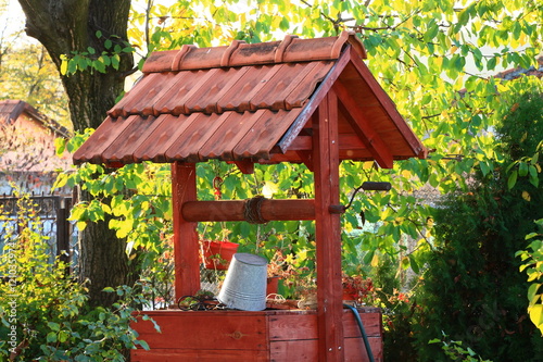 Wooden water well in the garden