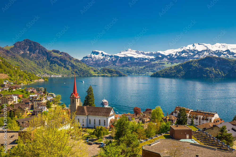 Village Weggi on lake Lucerne surrounded by Swiss Alps