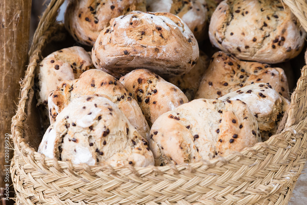 Assortment of baked bread in a wicker basket
