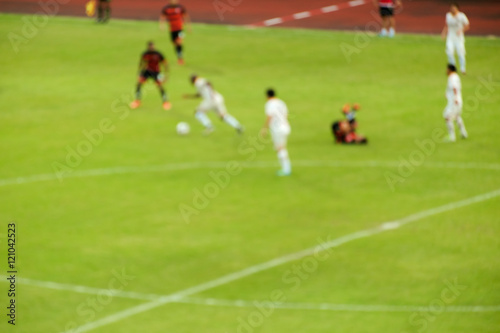 Football / Blur of football players running on the field during match. © wimage72