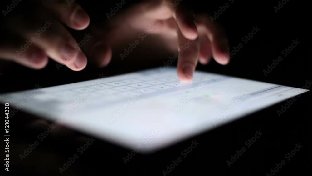 man touching tablet touch screen at dark man touching tablet touch screen at dark