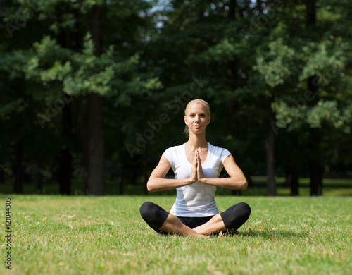 Beautiful woman doing yoga exercises