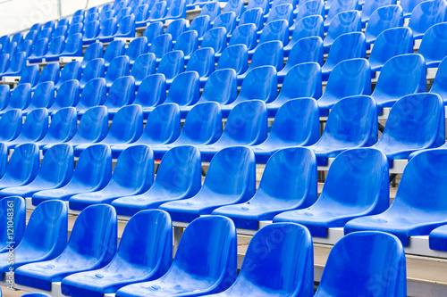 Empty blue stadium seats
