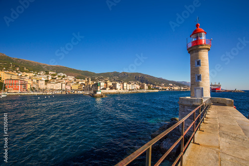 Lighthouse in Bastia harbour with Joannis Babtistes Cathedral