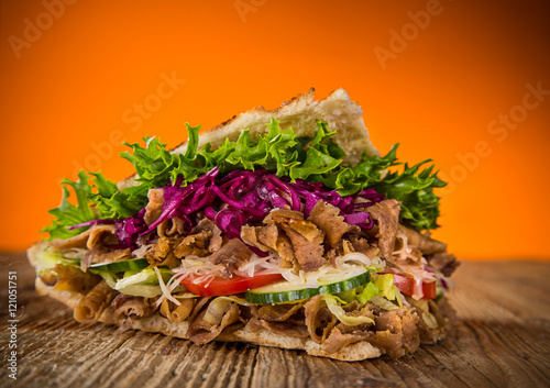 close up of kebab sandwich.