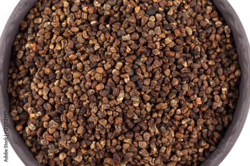 Decorticated cardamom seeds in a bowl photo