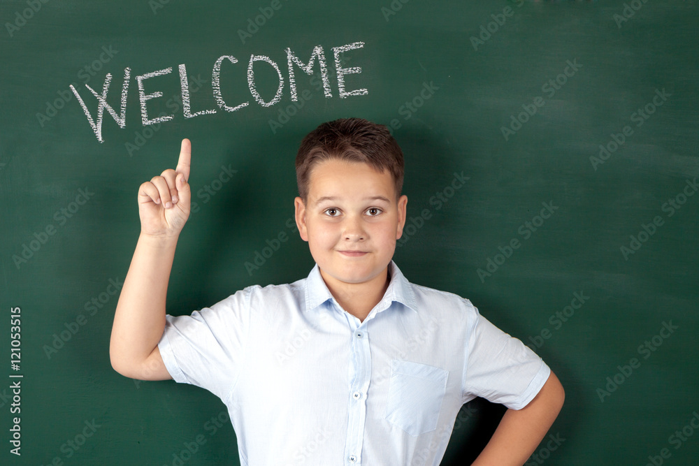 boy in a shirt with school boards