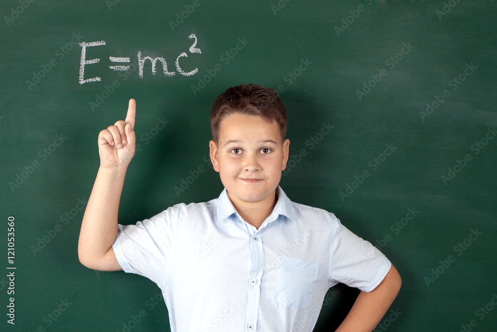 boy in a shirt with school boards