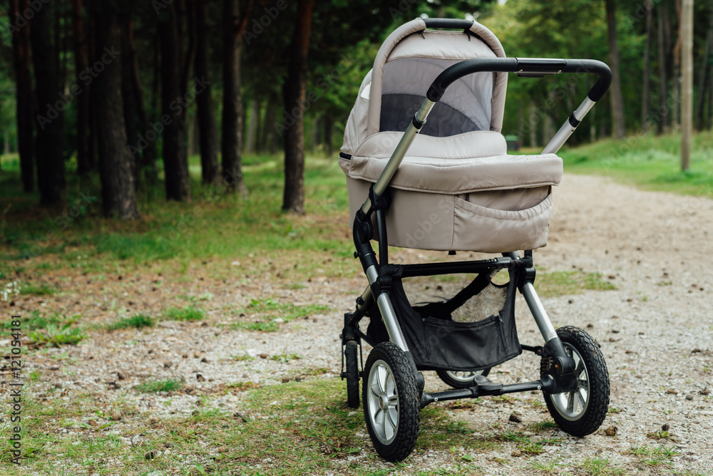 Fototapeta premium Baby stroller in forest