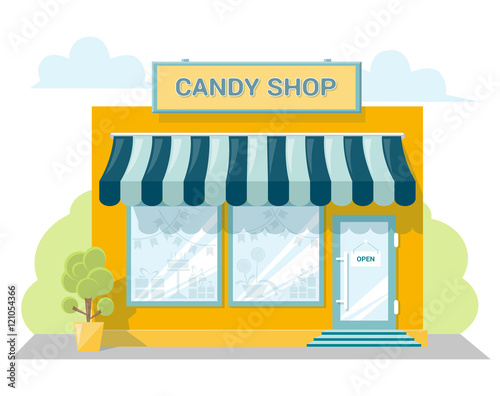 Fototapet Facade candy store with a signboard, awning and products in shopwindow