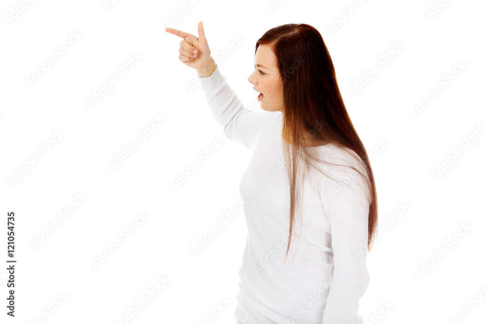 Young angry woman sceraming fora someone Young angry woman sceraming fora someone