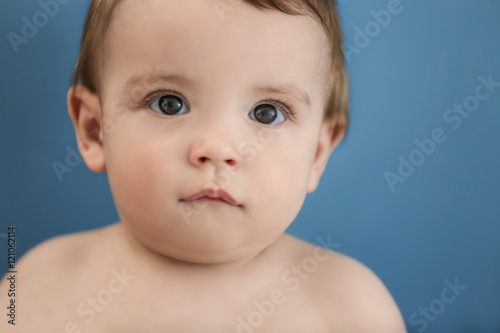 Cute baby on dark blue background  closeup