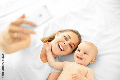Mother and baby taking self...