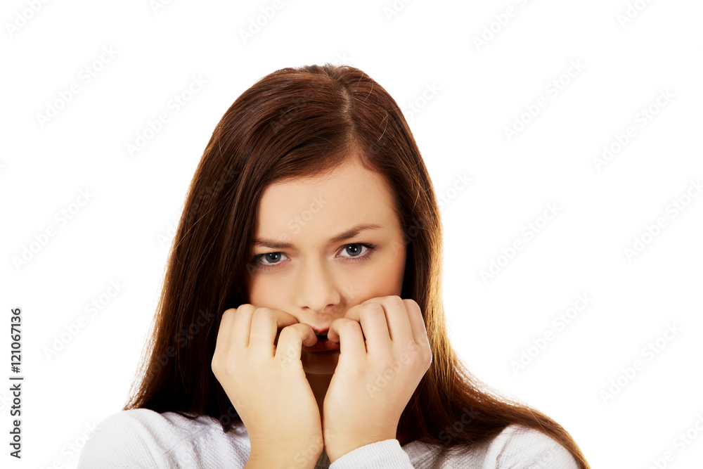 Young stressed woman biting her nails Young stressed woman biting her nails