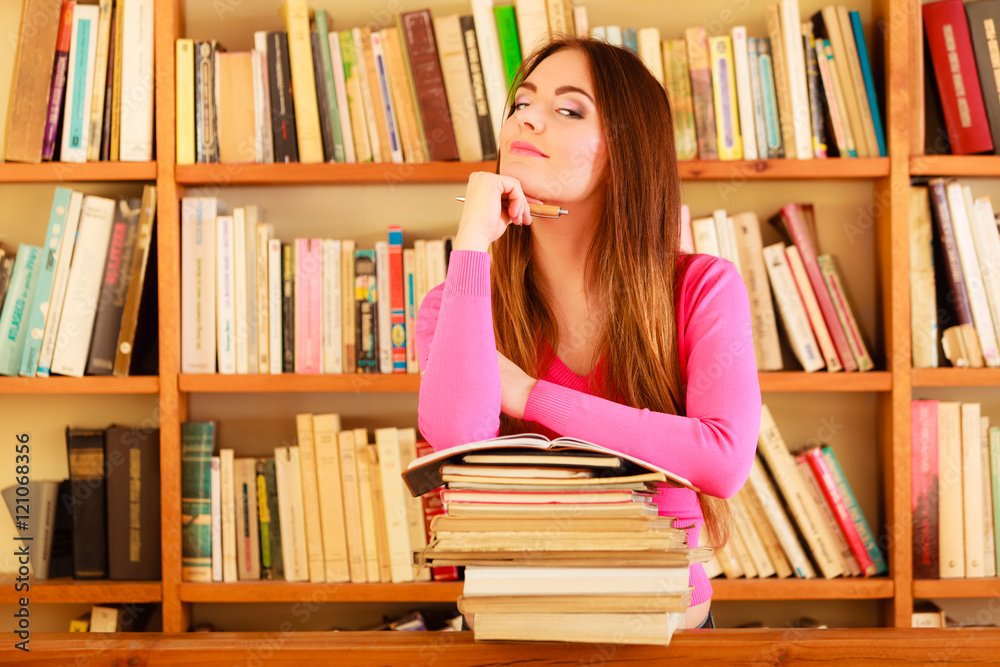 Girl student in college library Girl student in college library