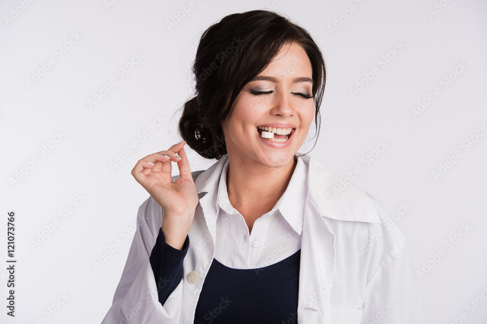 Young woman with a tablet pill in the mouth Young woman with a tablet pill in the mouth