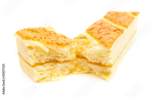 sections of sweet sponge cake on a white background