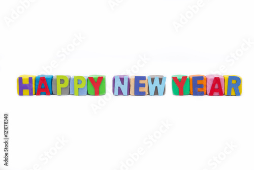 word Happy New Year by wooden letter on clay
