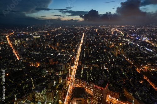 Beautiful aerial night view of Taipei, Taiwan with busy traffic light trails on the Xinyi Road © David Carillet