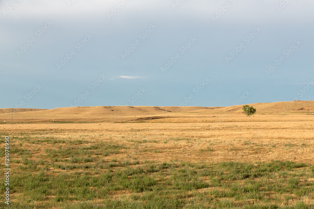 Fields and rolling hills in western South Dakota on a summer day. Fields and rolling hills in western South Dakota on a summer day.