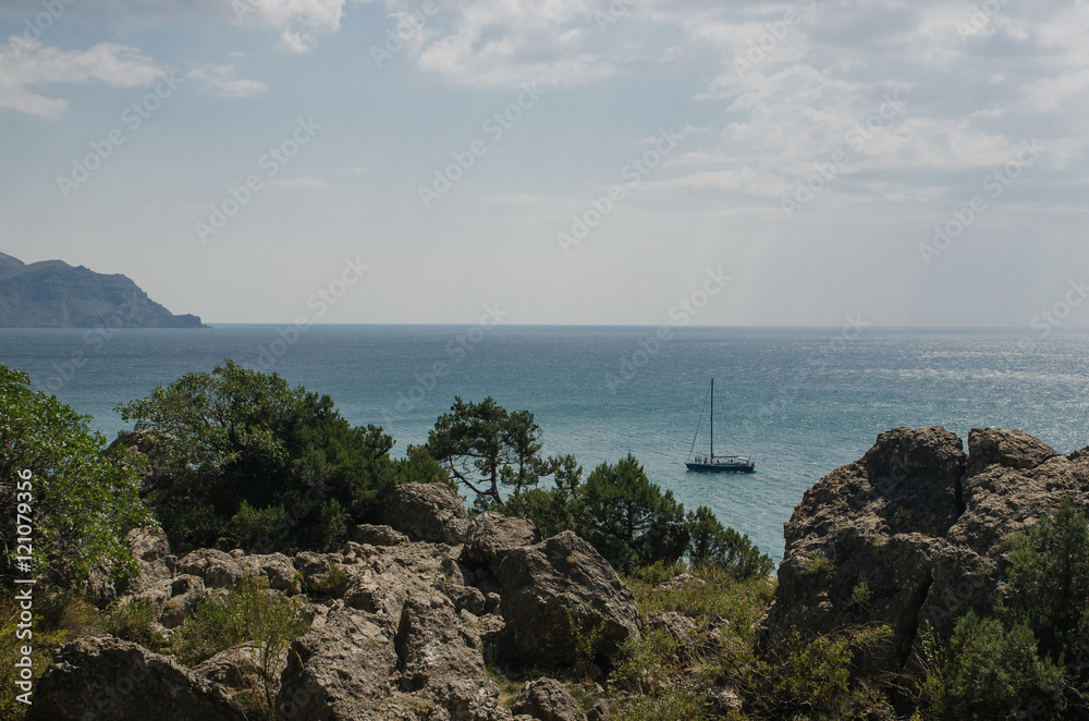 Yacht in the Black sea on blue sky background, Crimea
