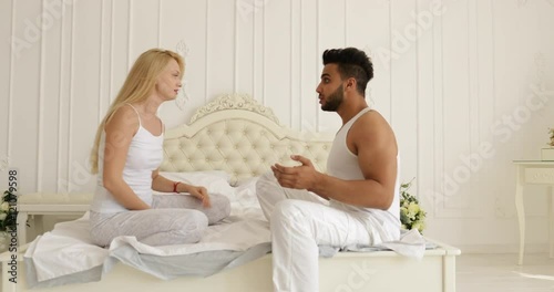 couple relationships problem fight conflict sitting on bed argue unhappy woman hit man negative emotion