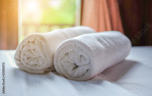 Fototapeta Naklejka Na Ścianę i Meble -  Clean white towel roll lay on the couch.