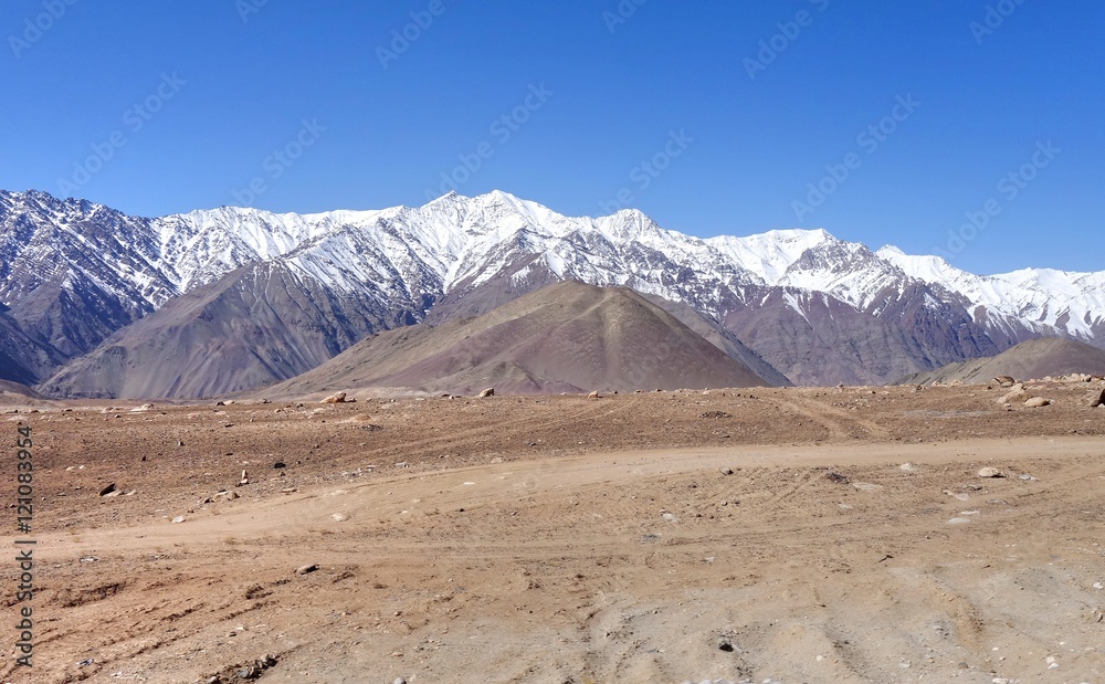 Snow mountain range at road side viewpoint on the way to Khardung La from Leh LADAKH, INDIA Snow mountain range at road side viewpoint on the way to Khardung La from Leh LADAKH, INDIA