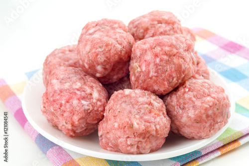 raw homemade meatballs prepared for cooking, isolated