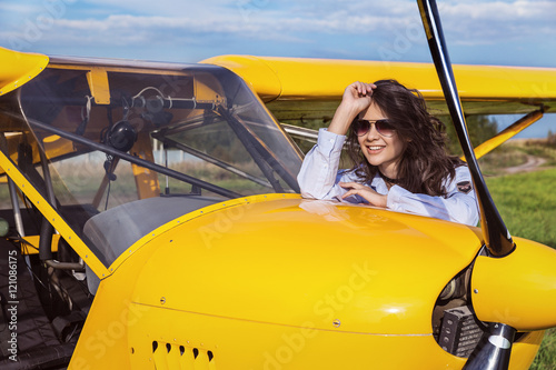 The girl in the yellow ultralight aircraft. photo