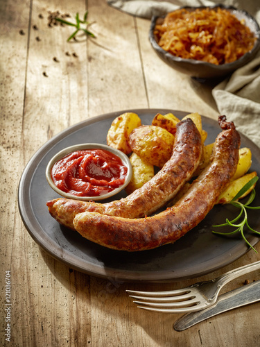 grilled sausages on dark plate