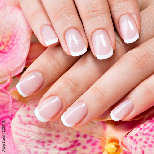 Beautiful woman s nails with french manicure