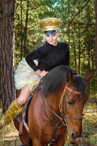 beautiful girl in uniform on horseback