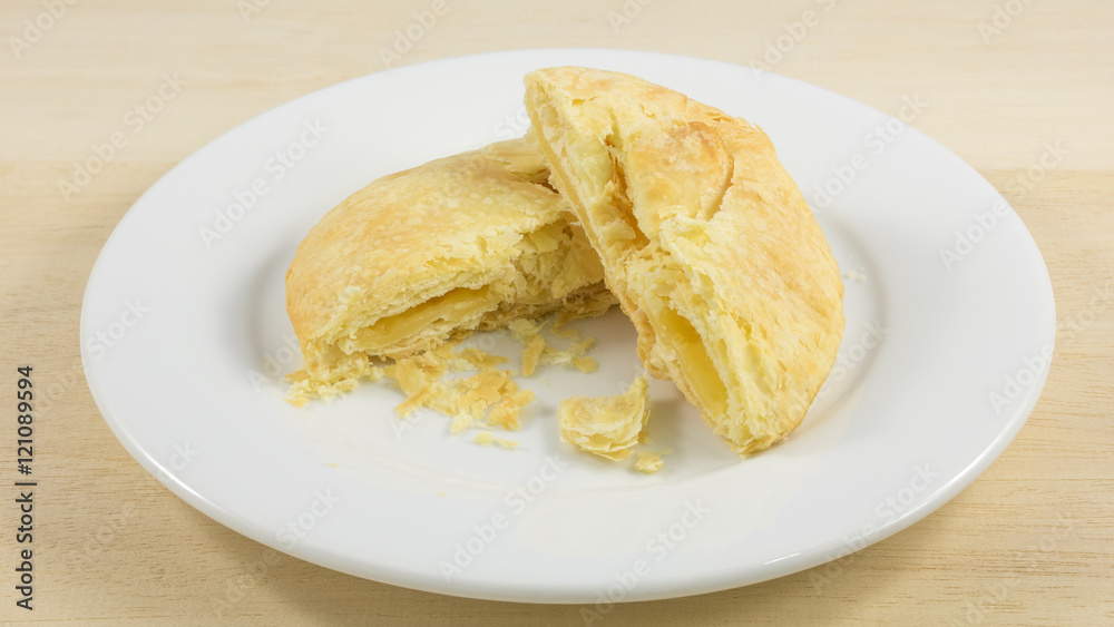 The Taiwanese sun cake (milk butter pastry) on the white plate.