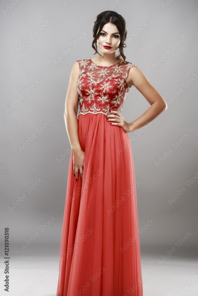 Portrait of a beautiful young woman in red dress. Portrait of a beautiful young woman in red dress.