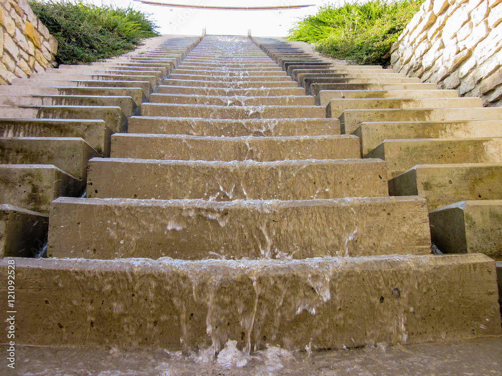 Water flowing down the stairs (close view). Water flowing down the stairs (close view).