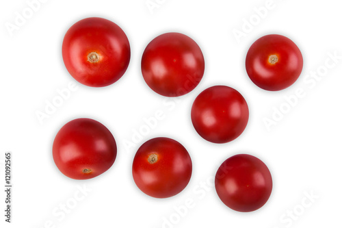 Ripe red cherry tomatoes scattered, isolated on white background