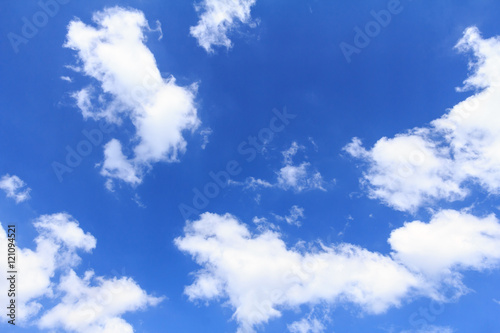 Fototapeta Naklejka Na Ścianę i Meble -  Blue sky background with white clouds. The vast blue sky and clouds sky on sunny day. White fluffy clouds in the blue sky.