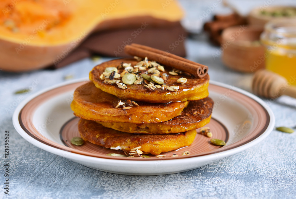 Homemade Pancake with pumpkin and spices on gray background