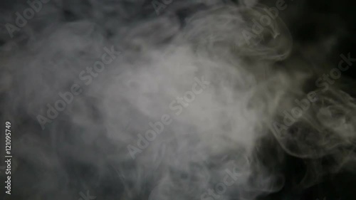 Fumo reale prodotto da macchina del fumo con sfondo nero. Slow Motion. Colorabile in post produzione. photo
