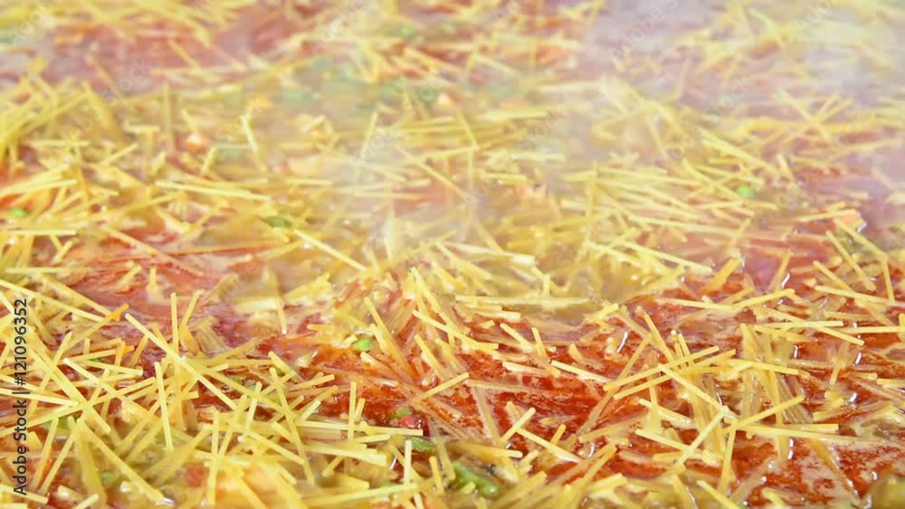 Preparing a delicious typical fideua of Valencia, Spain.
Preparing a delicious typical fideua of Valencia, Spain.