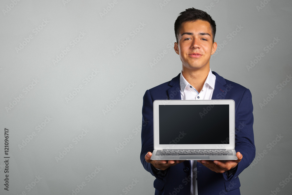 Portrait of smiling young man with laptop Portrait of smiling young man with laptop