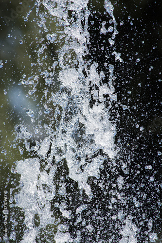 water drops in the air. Blurred soft abstract background. drop fountain.