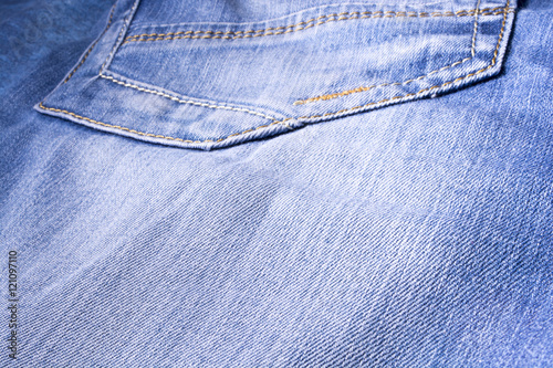 Jeans texture. Denim. The seam on the fabric. photo