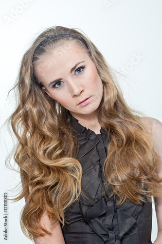 portrait of a woman with long hair. A woman can be very different , it emits a lot of different emotions .