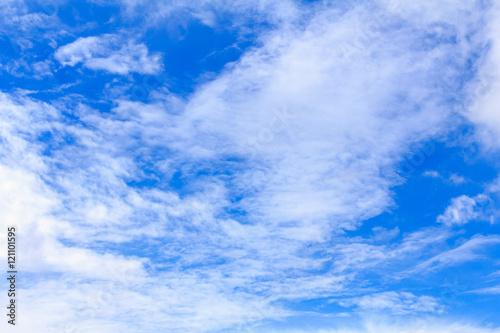 Blue sky background with white clouds. The vast blue sky and clouds sky on sunny day. White fluffy clouds in the blue sky.