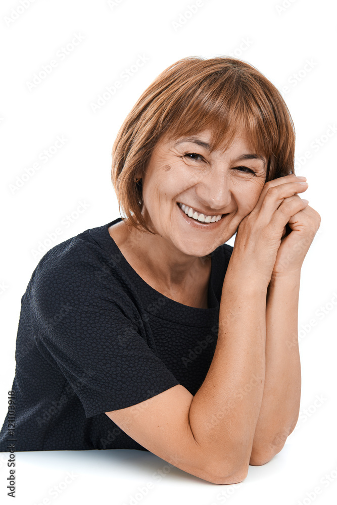 Portrait of a smiling beautiful mature woman on a white background Portrait of a smiling beautiful mature woman on a white background