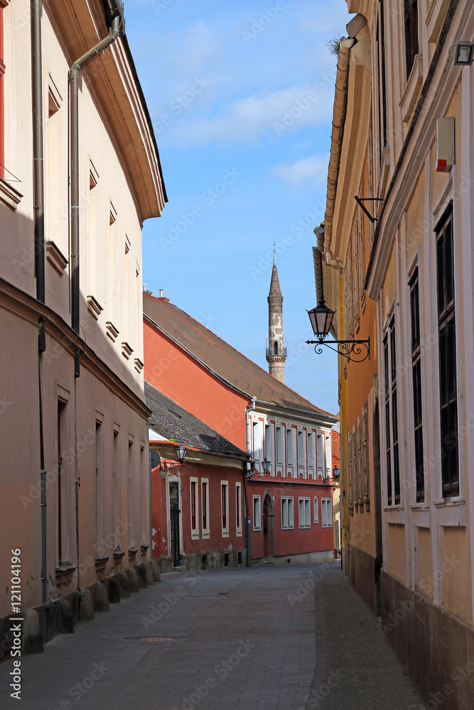 street with old buildings and minaret Eger Hungary