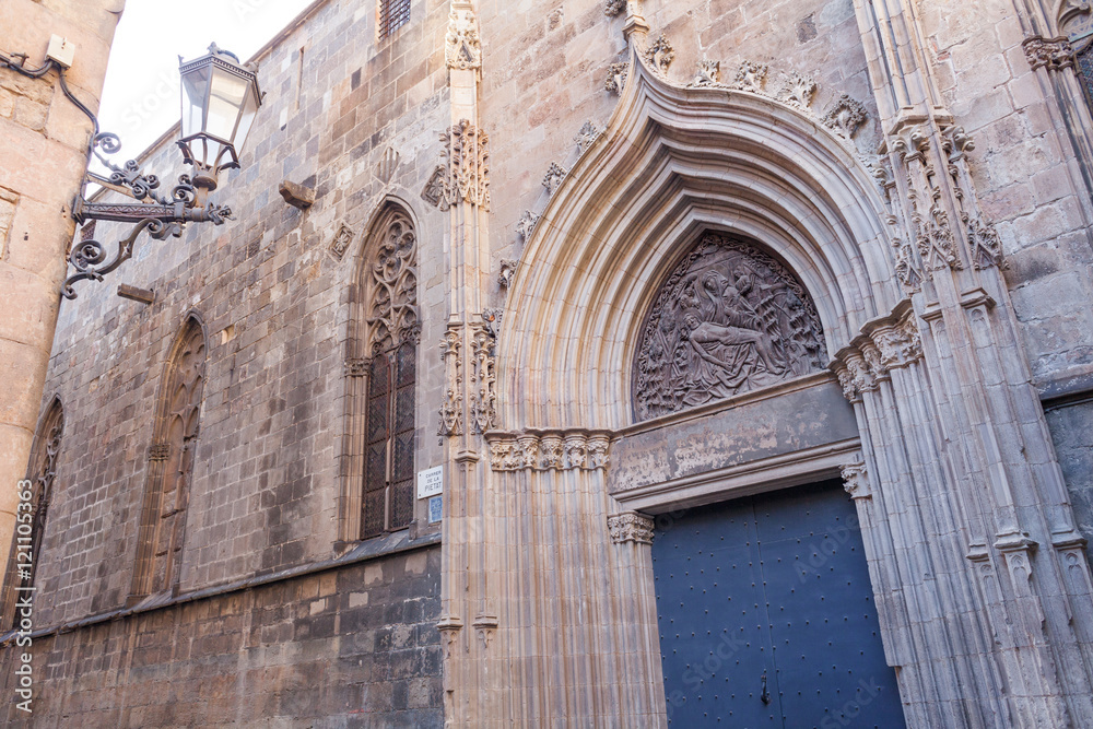 Side door of the Cathedral of the Holy Cross and Saint Eulalia in Barcelona, Catalonia, Spain