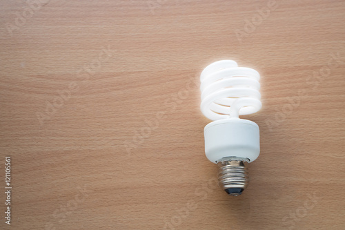 Electric lamp with lighting on wood flooring photo